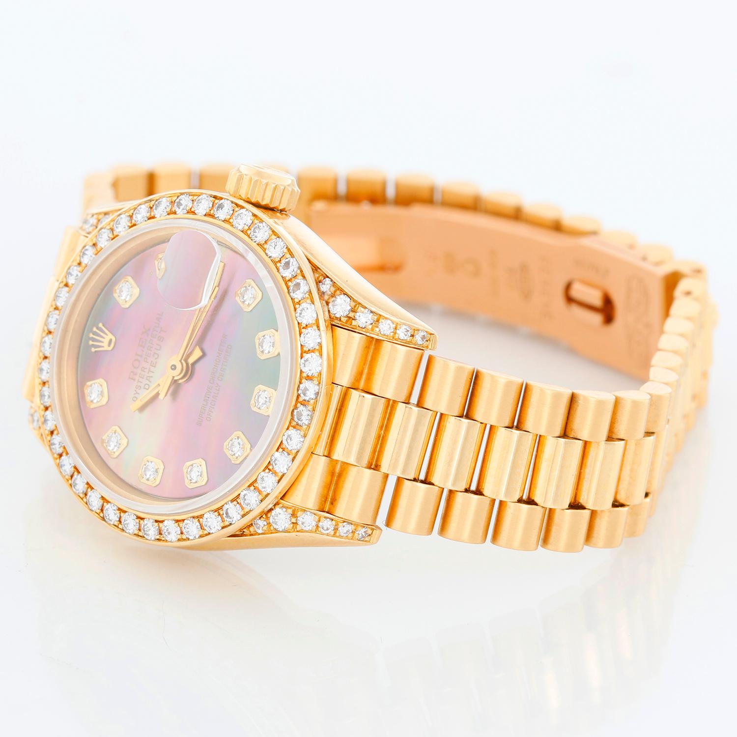Ladies Rolex President 18k Gold & Diamond Watch 69158 - Automatic winding. 18k yellow gold case with factory diamond bezel and factory diamond lugs (26 mm). Genuine Rolex mother of pearl diamond dial with diamond hour markers. 18k yellow gold Rolex