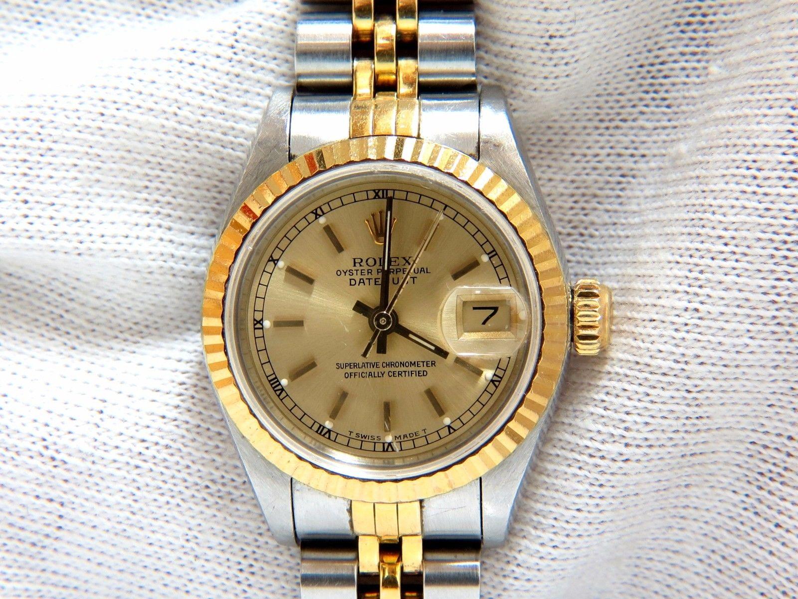 Ladies Two Toned Authentic Rolex Oyster DateJust.
Ref 69173 
Two Toned / Three Bodied Case.
Screw Down Case Back & Crown.
Fluted, 18kt. Gold bezel & Cyclops Lens
Baton Yellow gold hands.
18kt yellow gold & steel bracelet for 6.75 inch wrist.
Jubilee