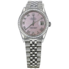 Rolex da donna con quadrante in madreperla rosa e lunetta con diamanti