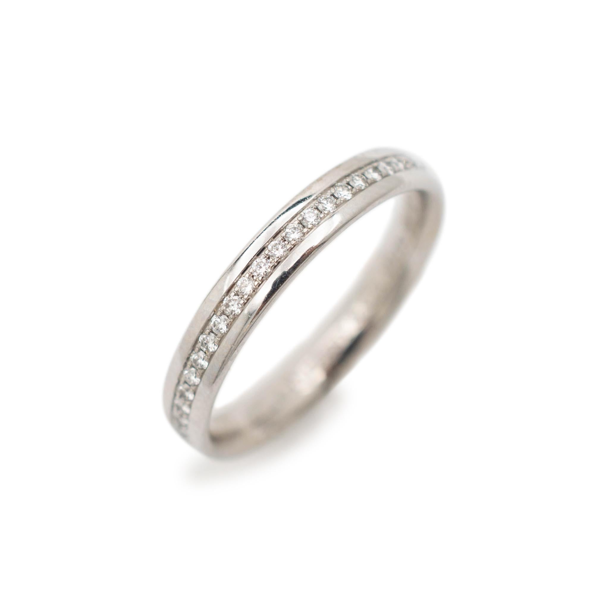 Brand: Tiffany & Co. 

Gender: Ladies

Material: 18K White Gold

Size: 6

Shank Width: 0.34 mm

Weight: 2.84 Grams

Ladies 18K white gold diamond wedding band with a half-round shank.

Engraved with 