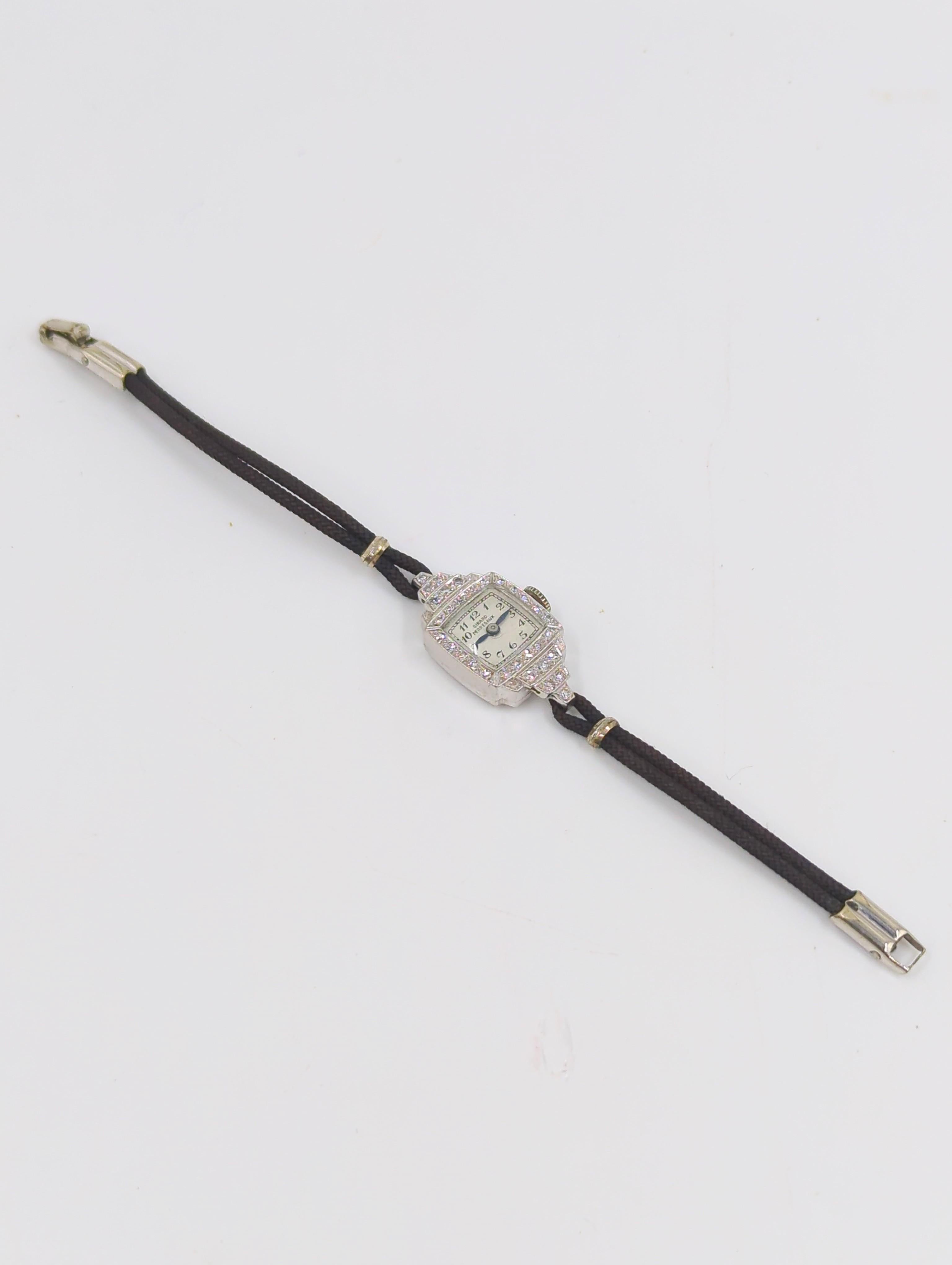 Rare montre vintage en platine et diamants de Girard Perregaux pour dames, délicate mais très bling bling, sur bracelet en cordon et métal, avec un fermoir de sécurité, pour un petit poignet de 5,75