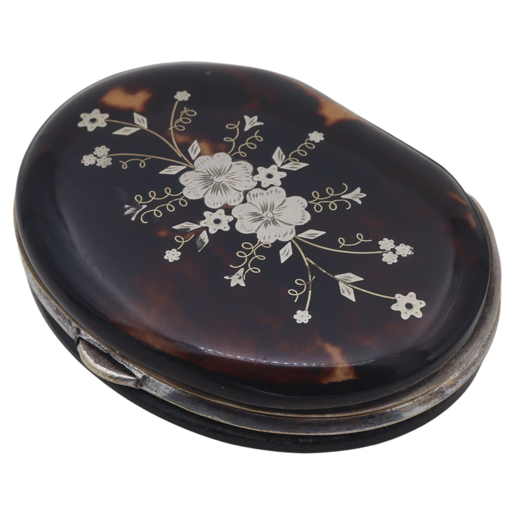 Ladies tortoiseshell coin purse inlaid with silver flowers