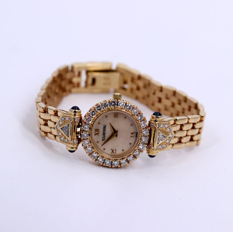 Ladies Tourneau Gold Watch with Diamonds Sapphires and Mother of Pearl