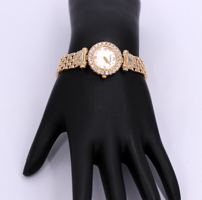 Ladies Tourneau Gold Watch with Diamonds Sapphires and Mother of Pearl