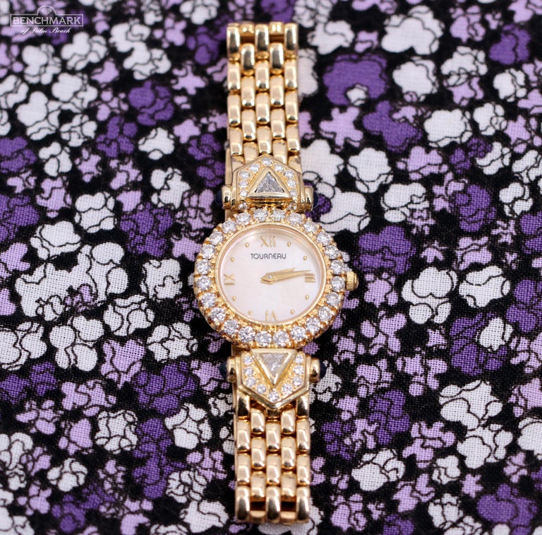 Ladies Tourneau Gold Watch with Diamonds Sapphires and Mother of Pearl