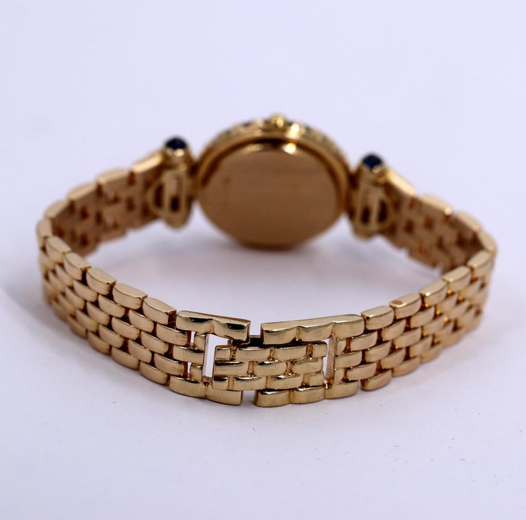 Ladies Tourneau Gold Watch with Diamonds Sapphires and Mother of Pearl