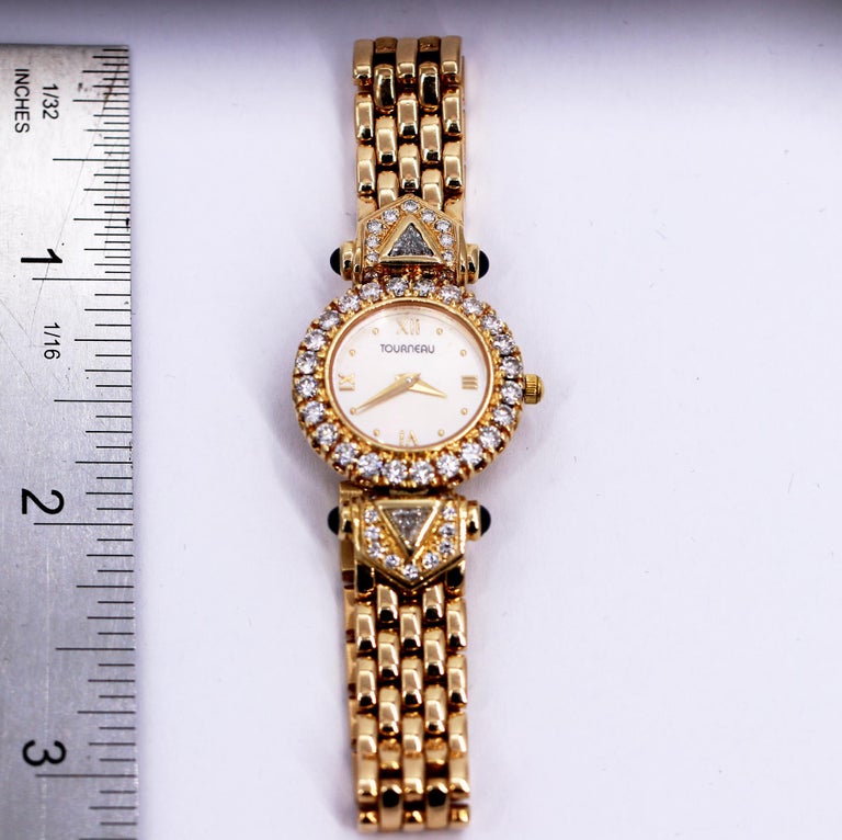 Ladies Tourneau Gold Watch with Diamonds Sapphires and Mother of Pearl