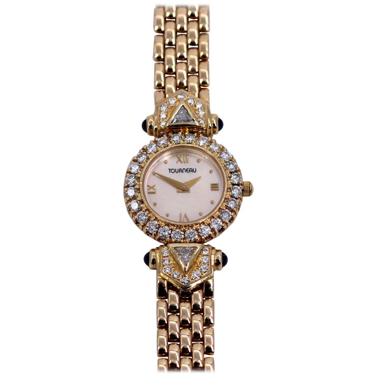 Ladies Tourneau Gold Watch with Diamonds Sapphires and Mother of Pearl
