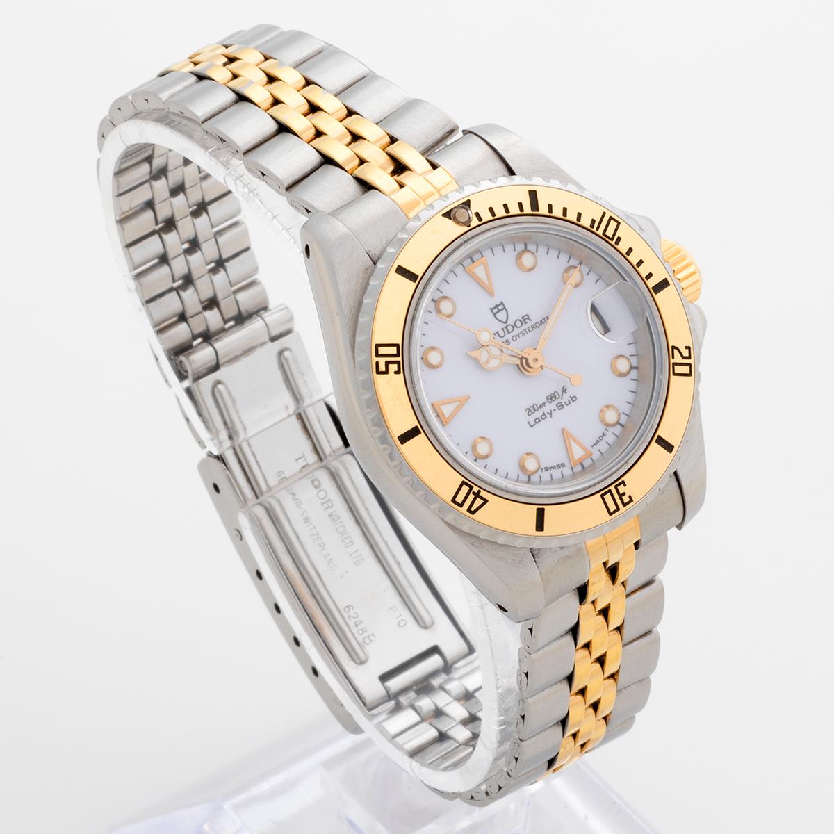 Our very rare vintage ladies Tudor Mini Sub, reference 96093 features a date, rotating bezel, automatic movement and gold capped with stainless steel 27mm case and bracelet. The case back is Rolex as is the gold tone original crown, as expected on