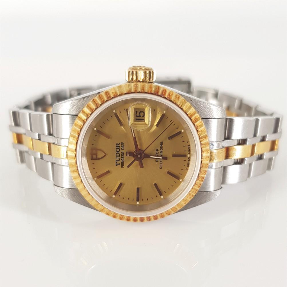 Tudor 18ct Yellow Gold Ladies Princess Date Watch – Automatic, condition very good.
Model Number: 92413 & Serial Number: B912270.
Stainless Steel & Gold case (25mm diameter). Gold dial with gold hands. Stainless Steel & Gold bracelet (46mm). 
Tudor