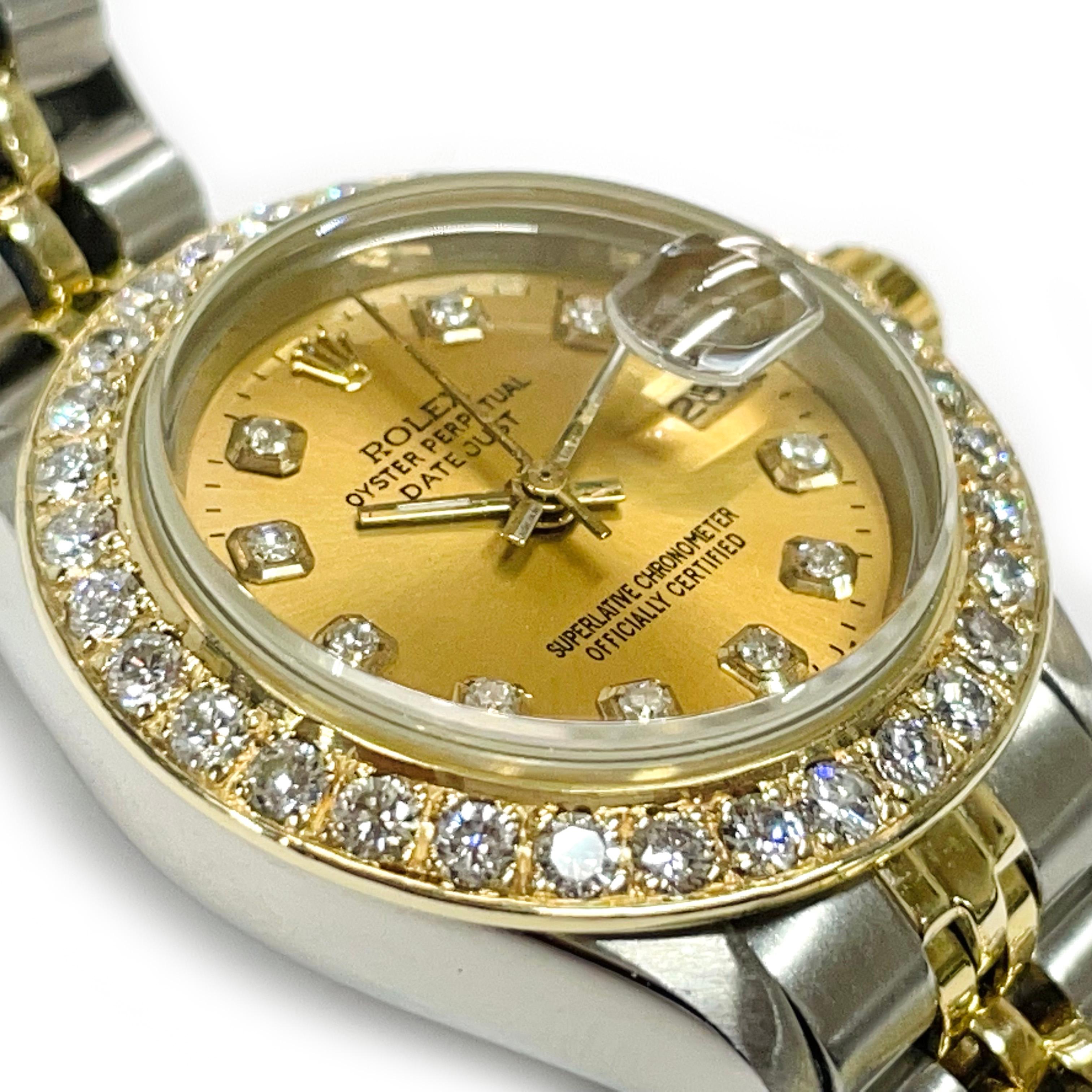Ladies Two-Tone Rolex Oyster Perpetual Datejust Diamond Bezel Watch. Absolutely exquisite wrist watch with a gold dial, hour, minute, and second hand, diamond hours, and diamond bezel. There are thirty-two 2.1mm round pave-set diamonds set on the