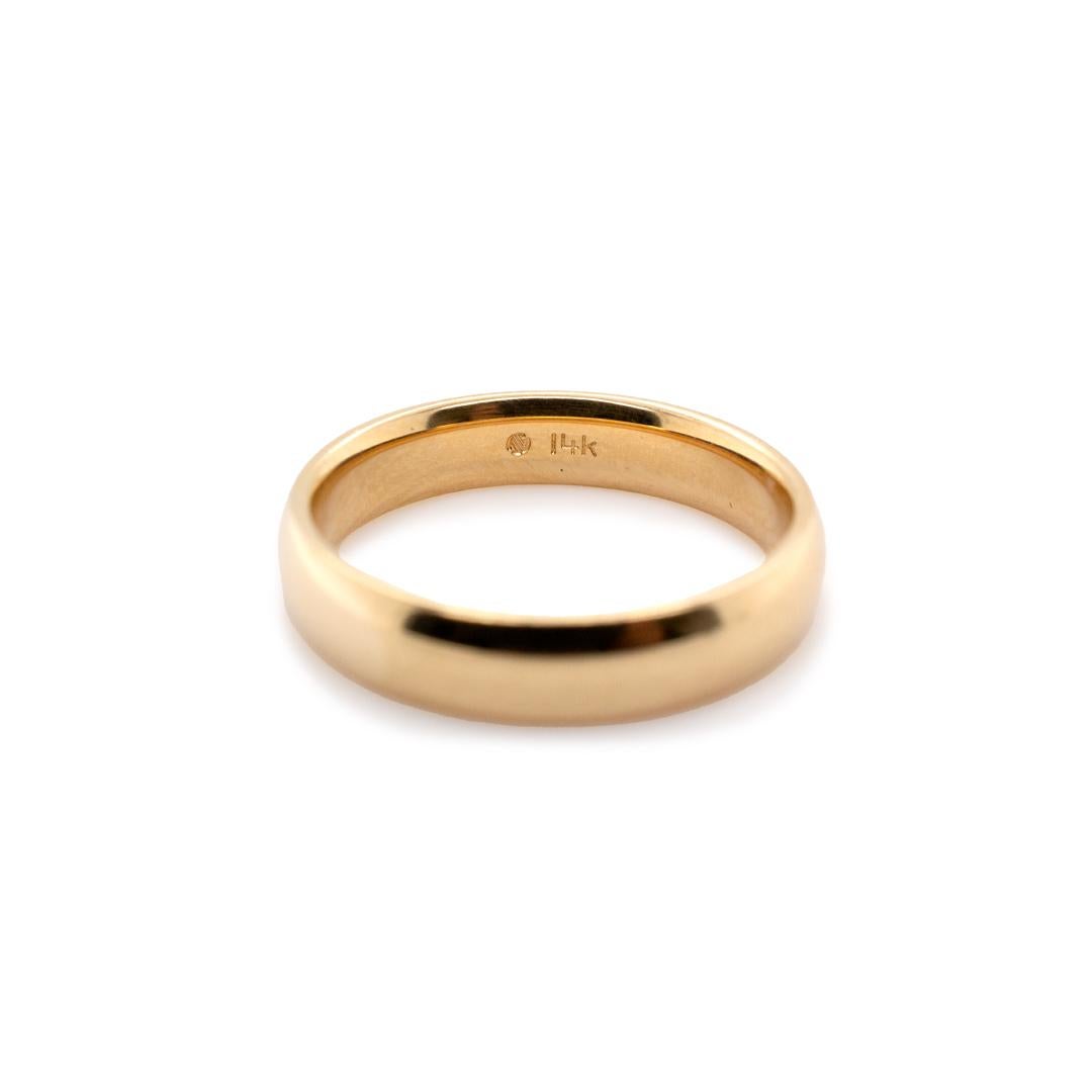One lady's custom made polished 14K yellow gold, solitaire, wedding, matching wedding band with a half-round shank. The band is a size 6 and is 3.90mm thick. The band weighs a total of 3.90 grams. Engraved with 