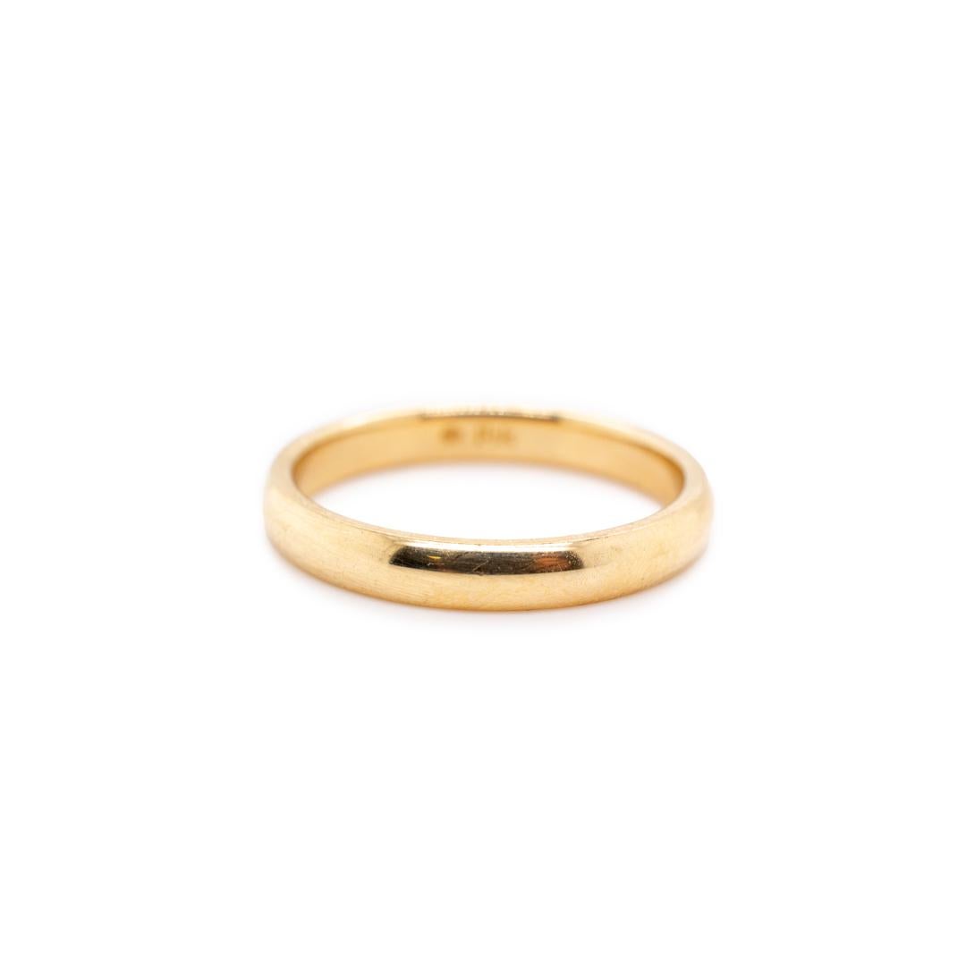 One lady's custom made polished 14K yellow gold, solitaire, wedding, matching wedding band with a half-round shank. The band is a size 7 and is 3.00mm thick. The band weighs a total of 3.20 grams. Engraved with 
