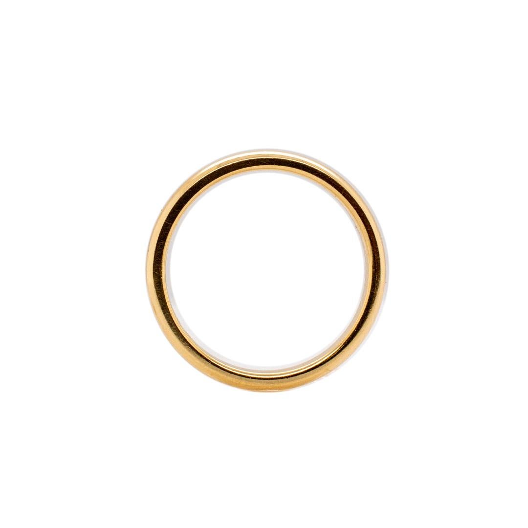 One lady's custom made polished 14K yellow gold, solitaire, wedding, matching wedding band with a half-round shank. The band is a size 6 and is 2.95mm thick. The band weighs a total of 3.10 grams. Engraved with 