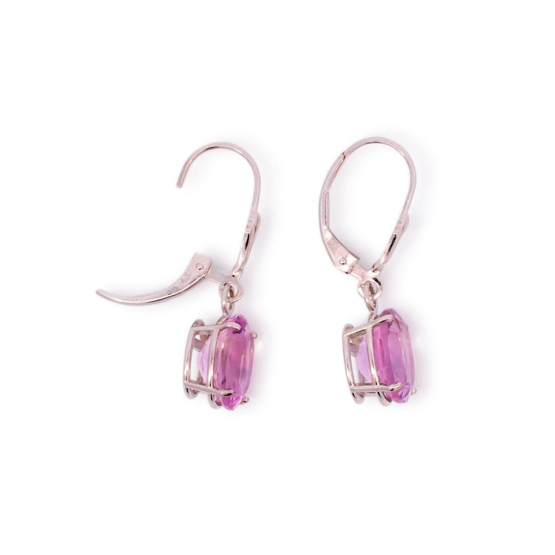 Gender: Ladies

Metal Type: 14k White Gold

Length: 1.00 inches

Width: 0.88 mm

Weight: 2.61 grams

Ladies 14K white gold quartz dangle earrings with french backs.

Engraved with 