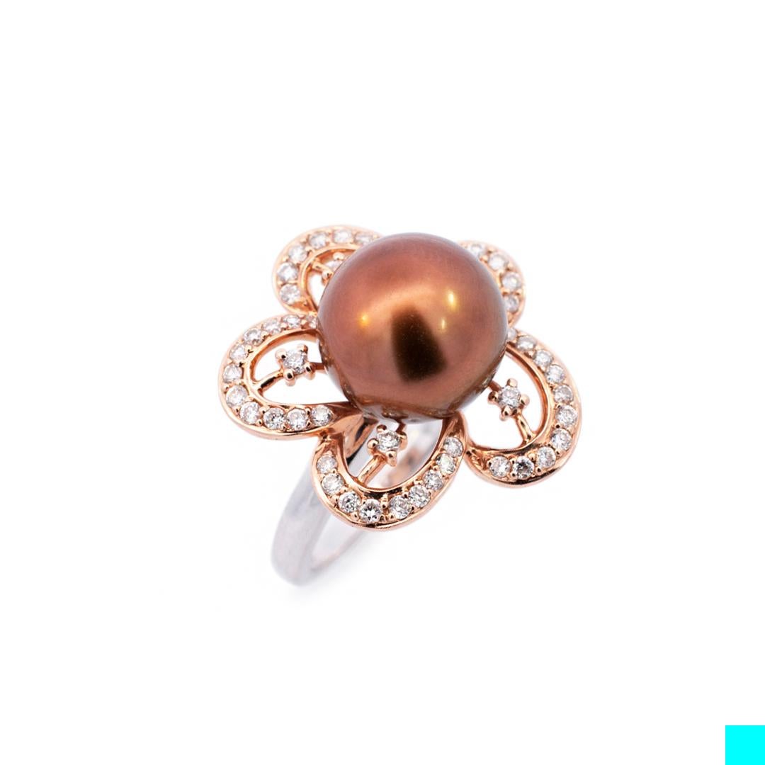 Gender: Ladies

Size (US): 7

Shank Width: 19.80mm

Thickness: 1.70mm

Weight: 5.65 grams

Ladies 14K white gold and 14K rose gold, diamond and pearl cocktail ring with a half round shank. Engraved with 