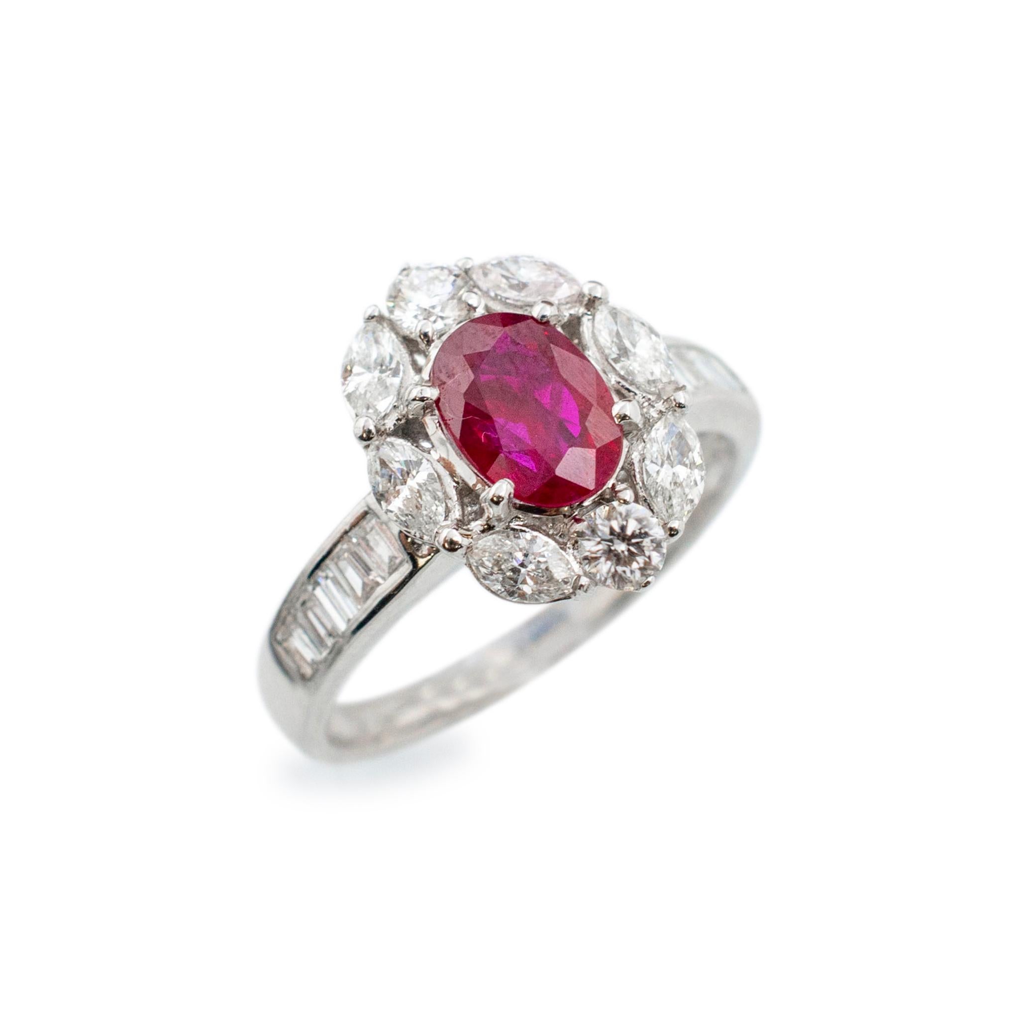 Gender: Ladies

Metal Type: 18K White Gold

Size: 6.75

Halo head measurements: 14.15mm x 11.10mm

Shank maximum width: 3.90mm

Weight: 4.40 grams

Ladies 18K white gold diamond and ruby cocktail ring with a half round shank.  Engraved with