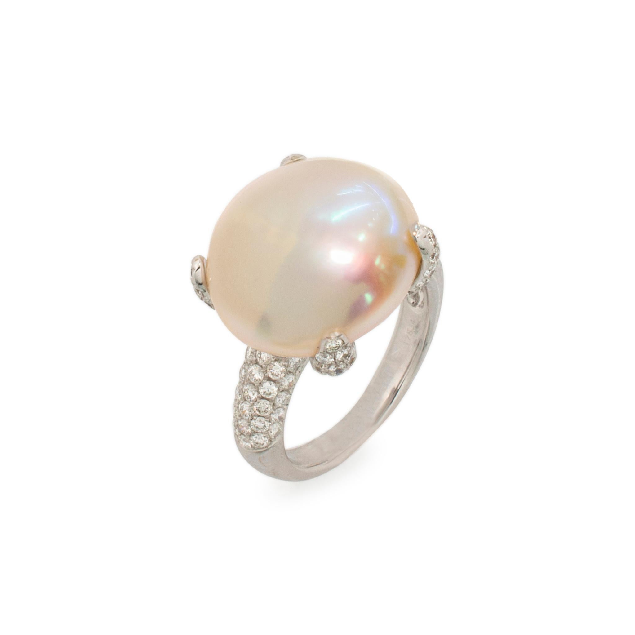 Gender: Ladies

Metal Type: 18K White Gold

Ring size: 6.5

Total weight: 9.88 grams

Natural pearl 18K white gold diamond cocktail ring with a half round shank.

Engraved with 