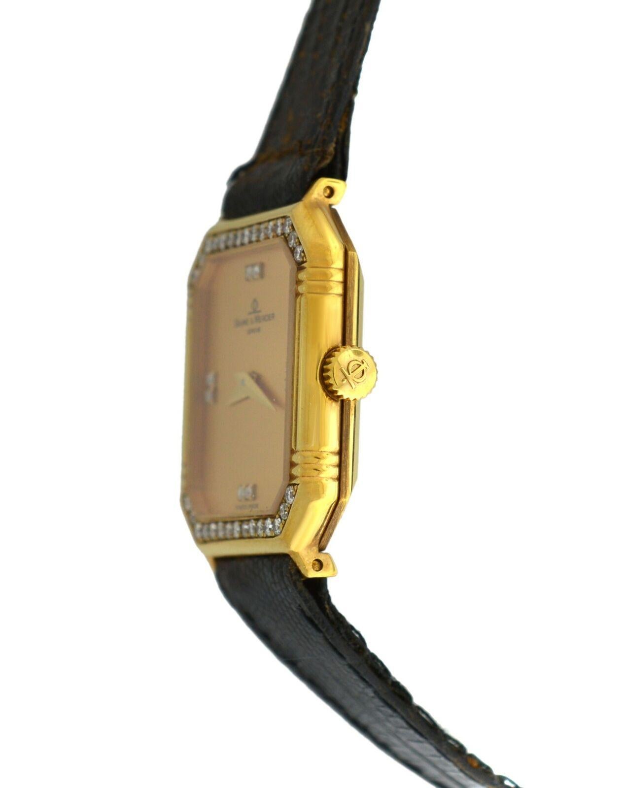 
Brand	Baume & Mercier
Model	18496
Gender	Ladies
Condition	New Store display
Movement	Swiss Quartz
Case Material	18K Yellow Gold
Bracelet / Strap Material	
Leather

Clasp / Buckle Material	
Gold plaque	
Clasp Type	Tang
Bracelet / Strap width	12 mm