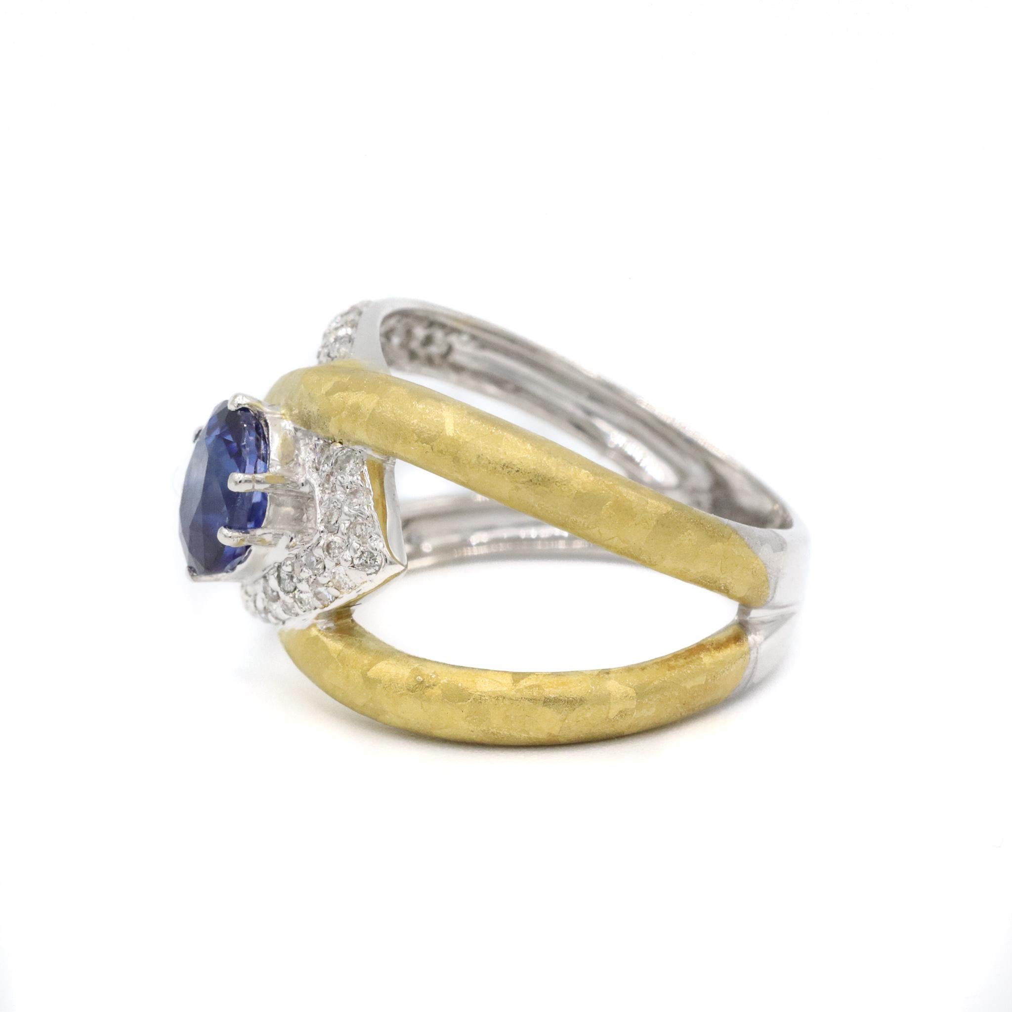 One lady's hand made brushed & polished rhodium plated, gold plated 18K white & yellow gold, sapphire and diamond vintage ring with a split-shank. The ring is a size 6.5. The ring weighs a total of 6.50 grams. Stamped 