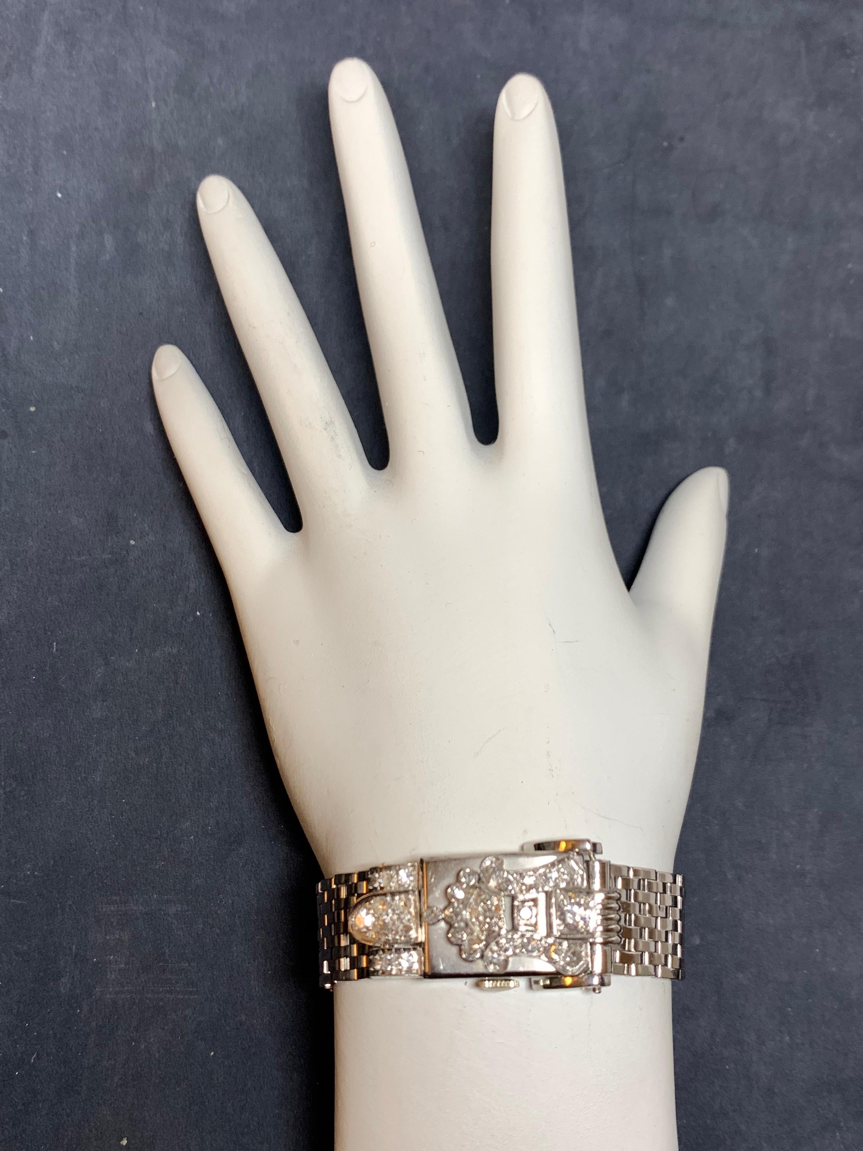 Rare Ladies Collectable Geneva Platinum set with approximately 0.60 carat of Natural Diamonds, Manual Wind Pop-Up Cocktail Watch. 
 
It is set with 32 natural colorless diamonds weighing approximately 0.60 carats, the watch itself weighs 52.2 grams