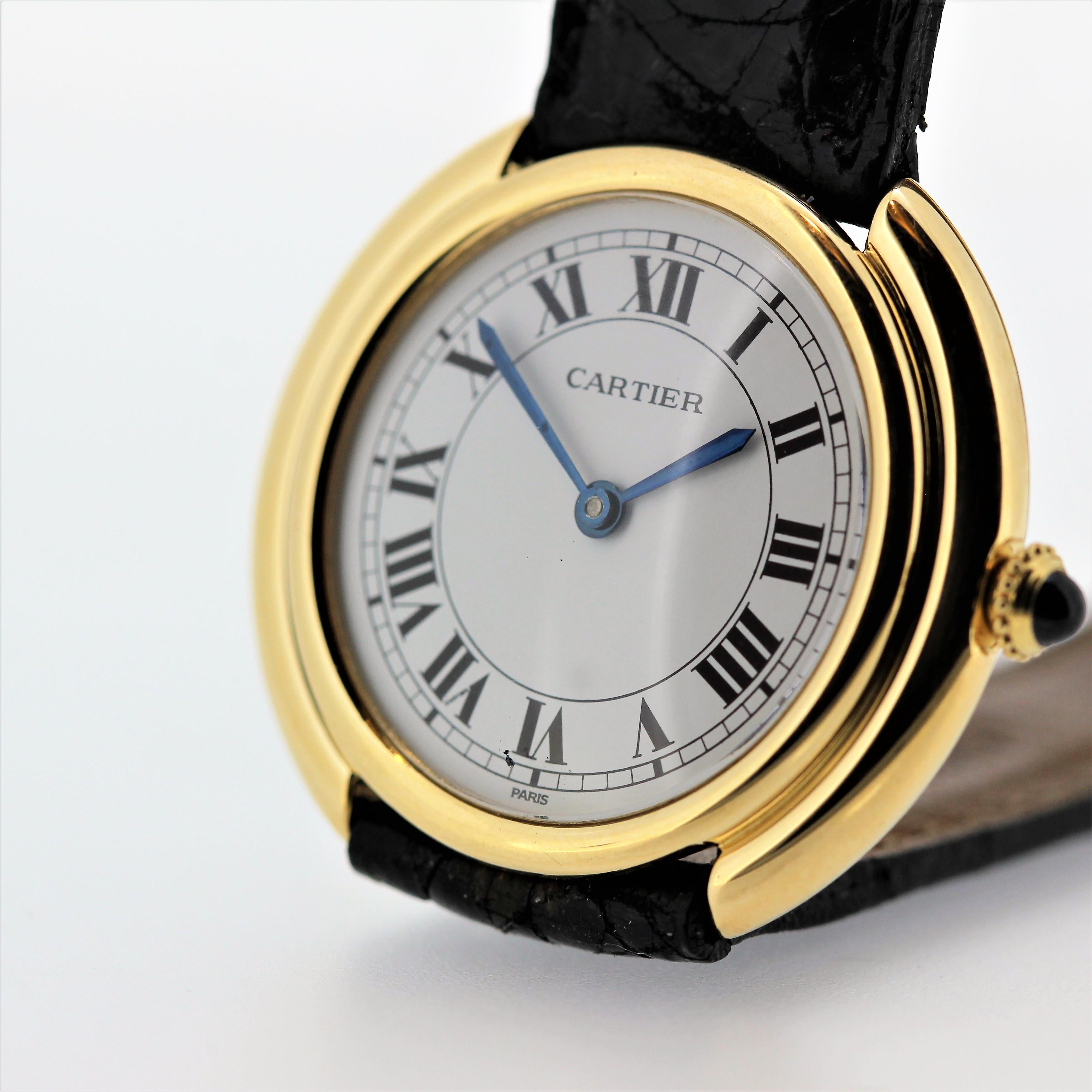 Introduction:
We Have 2 of this Vintage Cartier Watch.  
This Vintage Cartier Paris Vendome watch is the small size, circa 1975-1980.  It is 18K yellow gold and measures 26mm in diameter with mechanical manual wind 17 jewel movement.  It has a