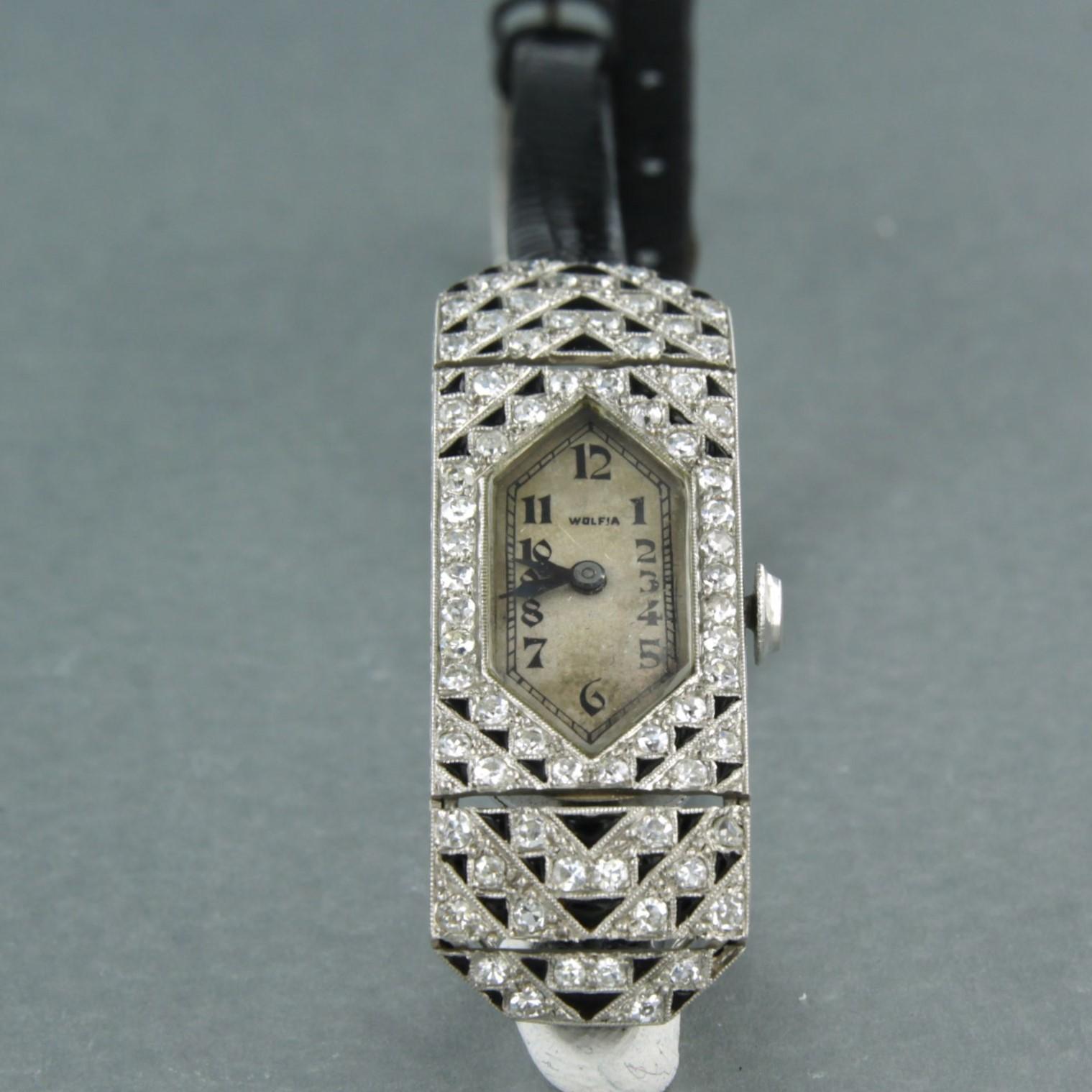 Platinum ladies watch decorated with enamel and set with old single cut diamonds. 1.00ct - F/G - VS/SI

detailed description:

The movement of the watch is an anchor escapement and is completely jeweled. Movement has been overhauled and runs well.