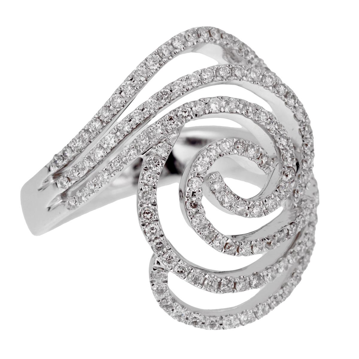 A fabulous ladies diamond cocktail ring featuring a circular pattern adorned with round brilliant cut diamonds in 18k white gold.