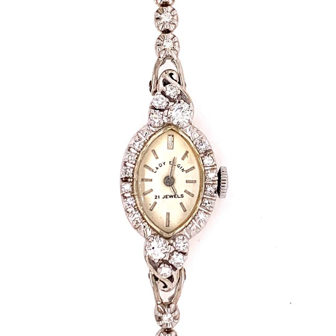 Rare Lady Elgin Collectable Ladies 14k White Gold with approximately 1 carat of Natural Diamond Manual Wind Cocktail Watch. 

It is set with 46 natural colorless diamonds weighing approximately 1 carat, the watch itself weighs 17.7 grams and is 6.5