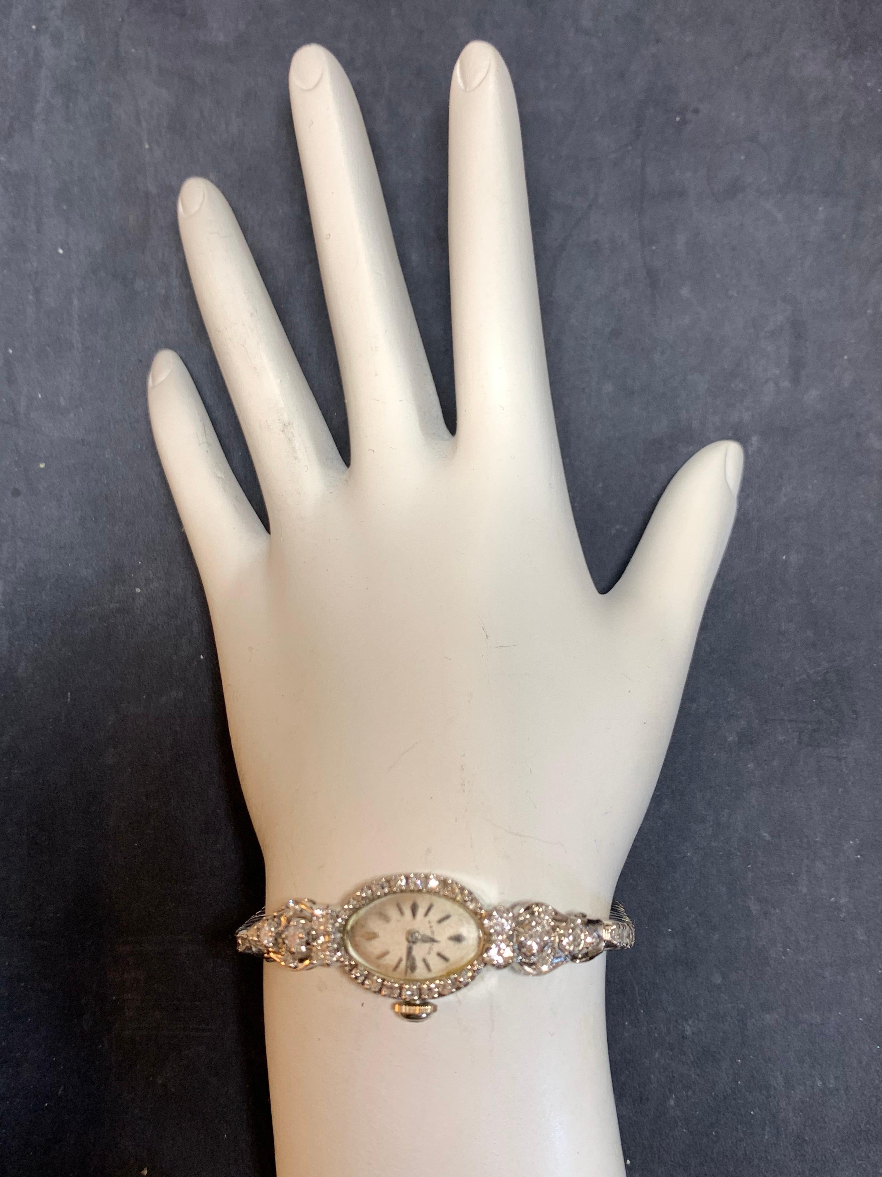 Rare Hamilton Collectable Ladies 14k White Gold with approximately 2 Carats of Natural Diamond Manual Wind Cocktail Watch. 

It is set with 52 natural colorless diamonds weighing approximately 2 carats, the watch itself weighs 18.9 grams and is 6