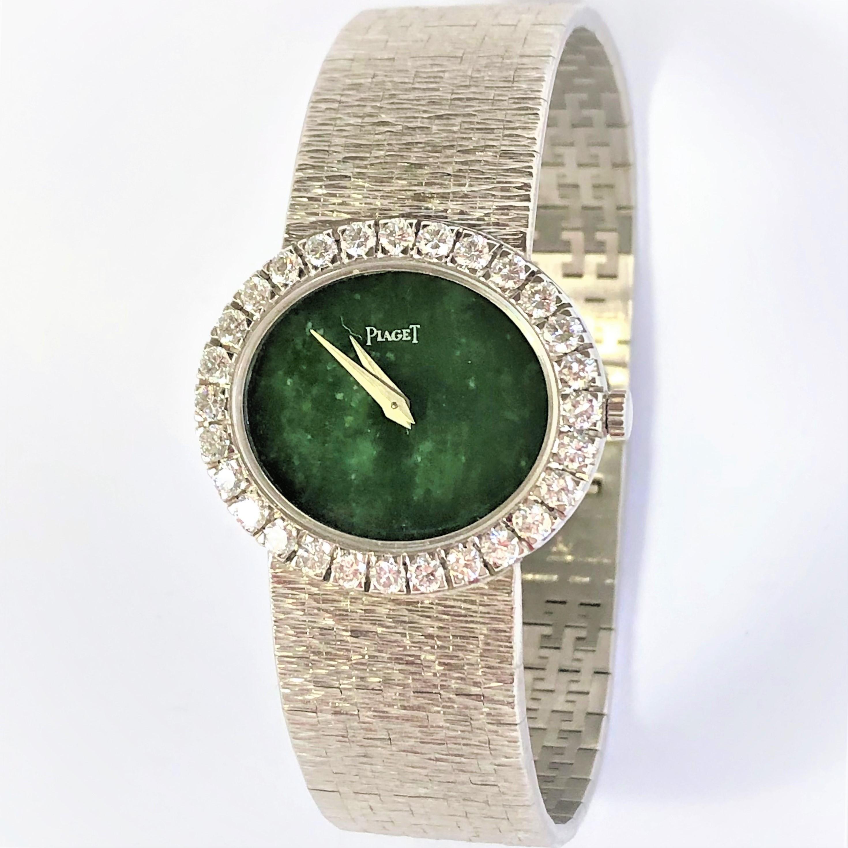 A ladies 18K white gold wristwatch by Piaget, set with 28 round brilliant cut diamonds weighing an approximate total of 2.00CT.  Measuring 27mm x 24mm, this lovely horizontal watch features a jade dial. Manual wind watch measuring  just under 6 3/4
