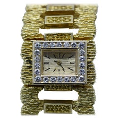 Montre-bracelet en or jaune à maillons en diamant pour dames