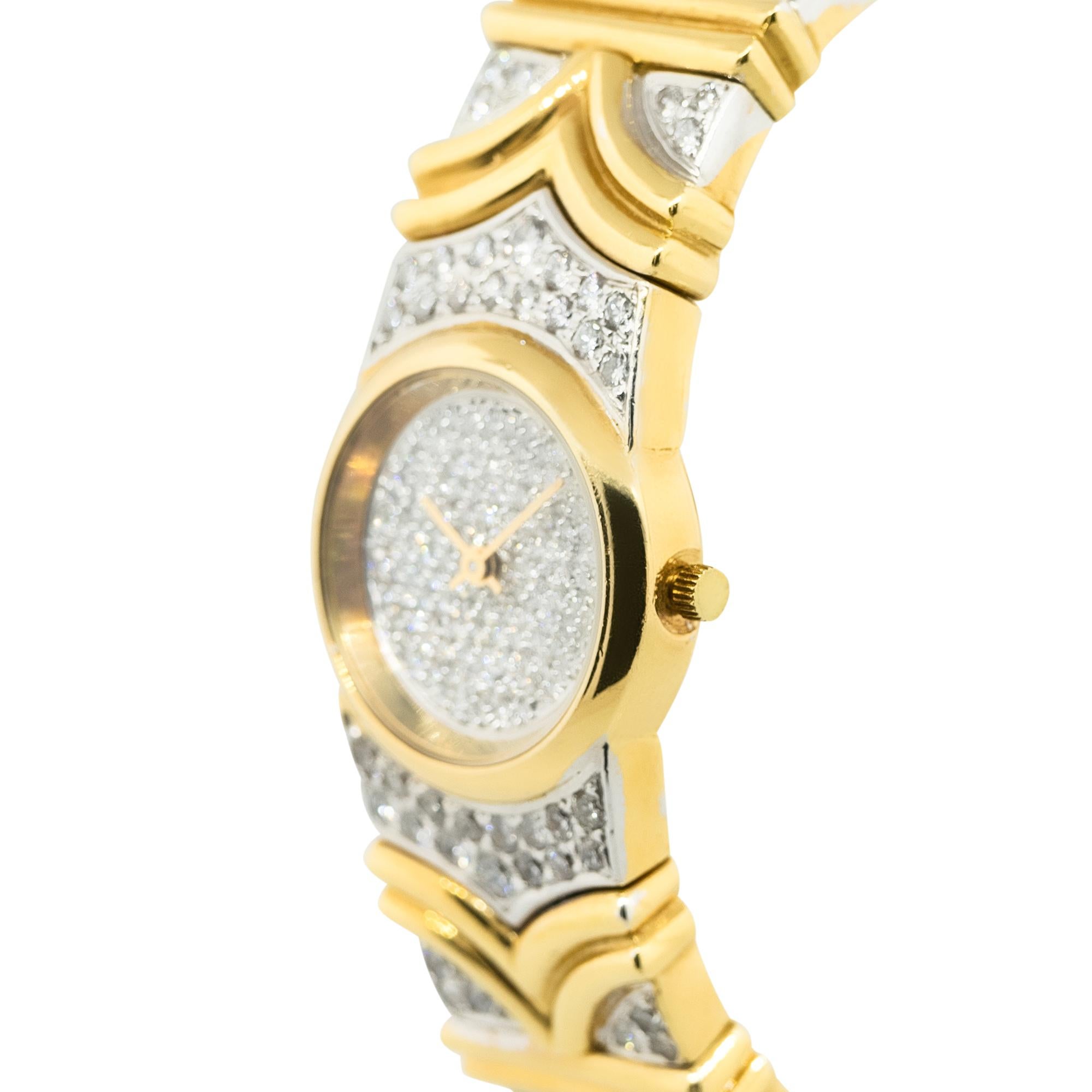 Material: 18k Yellow Gold
Dial: Pave Diamond Dial
Bezel: 18k Yellow Gold Smooth Bezel
Bracelet: 18k Yellow Gold Diamond Bracelet
Clasp: Cuff Style Bracelet
Movement: Automatic
Size: Will fit a 6