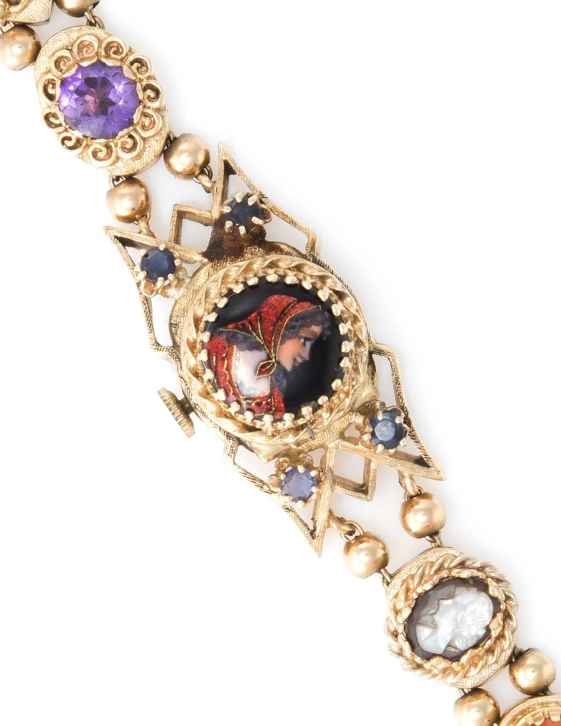 Overview:

Elegant vintage slide watch bracelet (circa 1940s), crafted in 14 karat gold. 

The bracelet features 9 slides set with jewels: turquoise is estimated at 0.05 carats, amethyst is estimated at 1.50  carats, emerald is estimated at 0.08