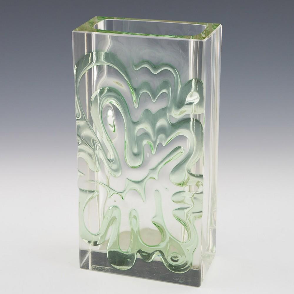 Ladislav Oliva for Exbor Amoeba Vase, 1970s

Additional information:
Date : Designed c1968
Origin : Novy Bor, Czechoslovakia (now Czech Republic). 
Bowl Features : Flashed, cut, and polished, amoeba design in green. 
Marks : None 
Type : Lead
Size :