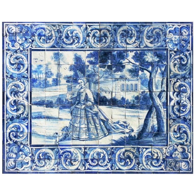 Blue over white panel picturing a lady with a fan and her dog
the Duchess of Fontanges was a mistress of Louis XIV of France . In the year of 1680 she started the fashion of a new coiffure - built in several floors with metallic wires  that support