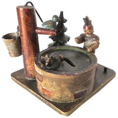 Antique "Lady and Baby by The Wishing Well" Still Bank, German, circa 1910
