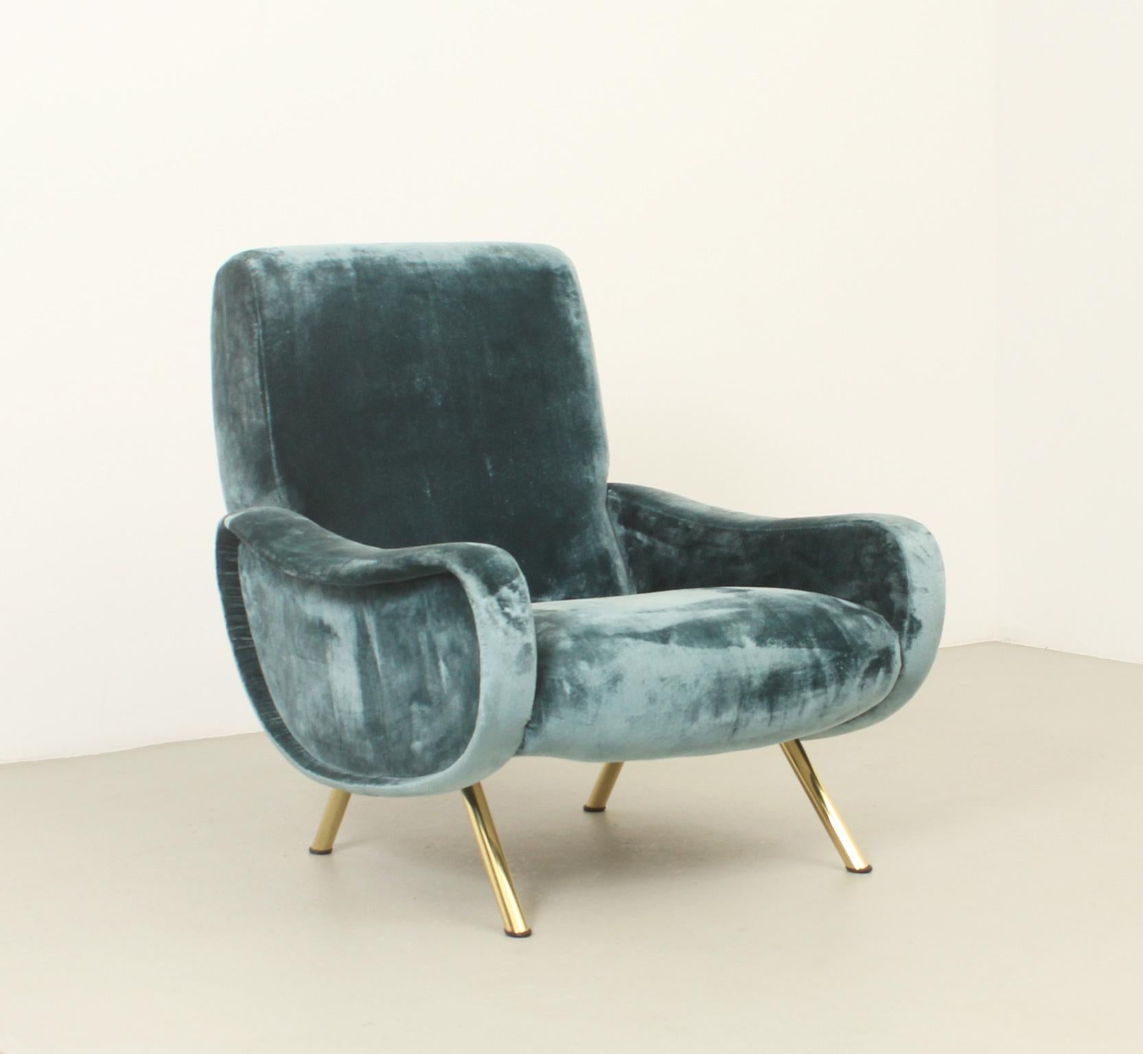 Lady armchair designed by Marco Zanuso in 1951 for Arflex, Italy. Early edition with original velvet fabric and brass bases. 