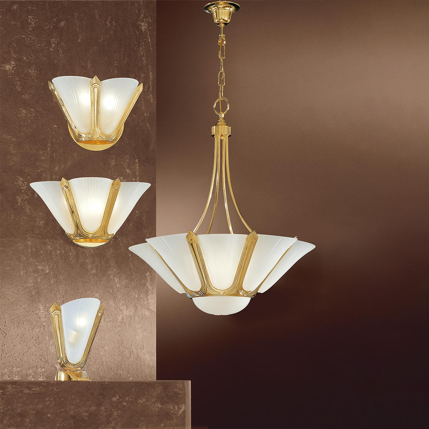 A stunning lighting fixture incorporating refined Art-Deco accents, this wall lamp is a showcase of opulence and craftsmanship. The glistening pure gold structure, etched with minute etched patterns, welcomes a couple of fan-like satin glass