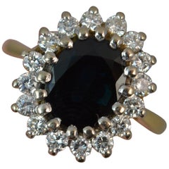 Lady Diana 2 Carat Blue Sapphire 0.50 Carat Diamond 18 Carat Gold Cluster Ring