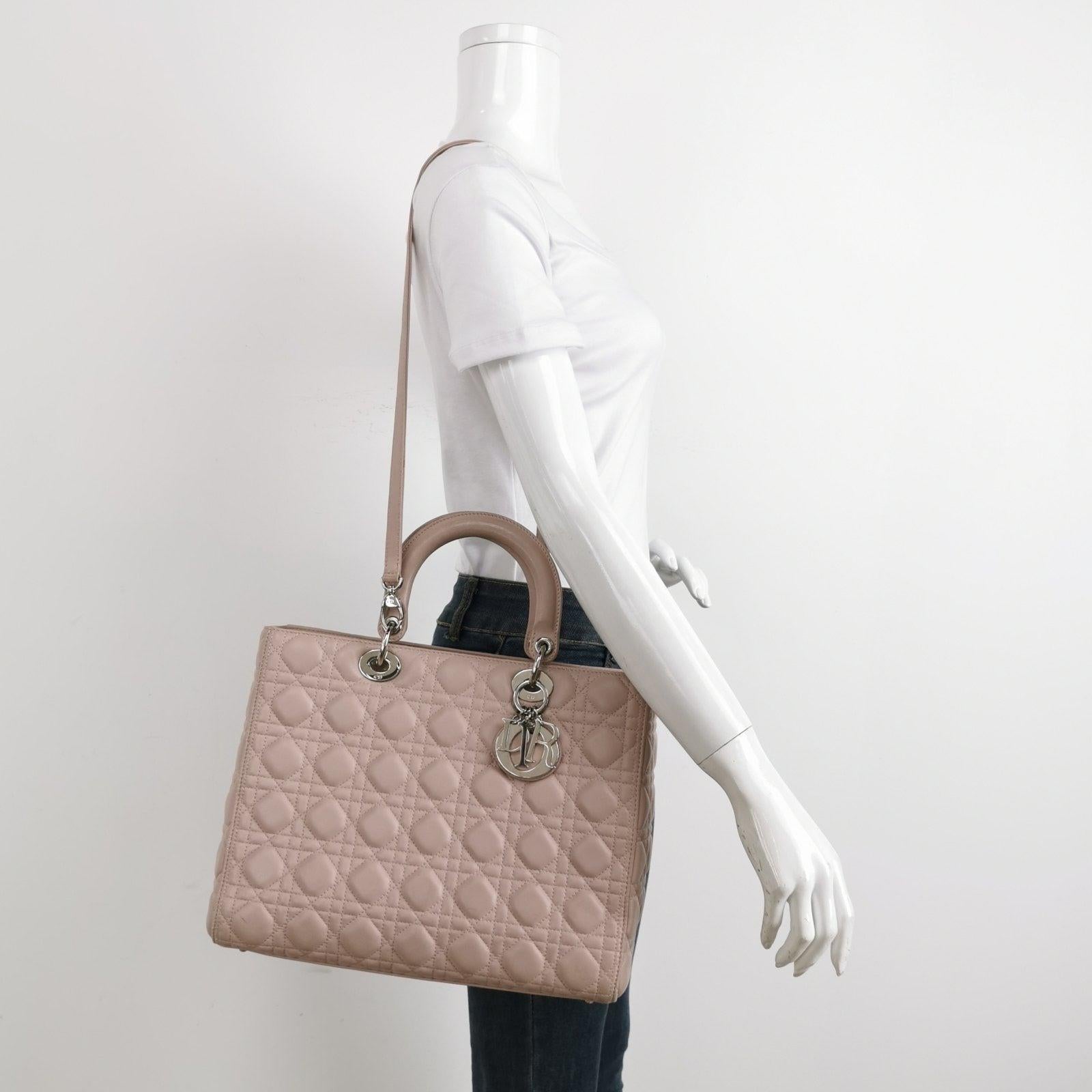 Lady Dior 2012 Large Bag Pink Lambskin Cannage Leather These are professional photos of the actual bag offered by Luxbags. This large Lady Dior is crafted in a rare stunning teal blue lambskin leather. This classic bag features a cannage stitch,