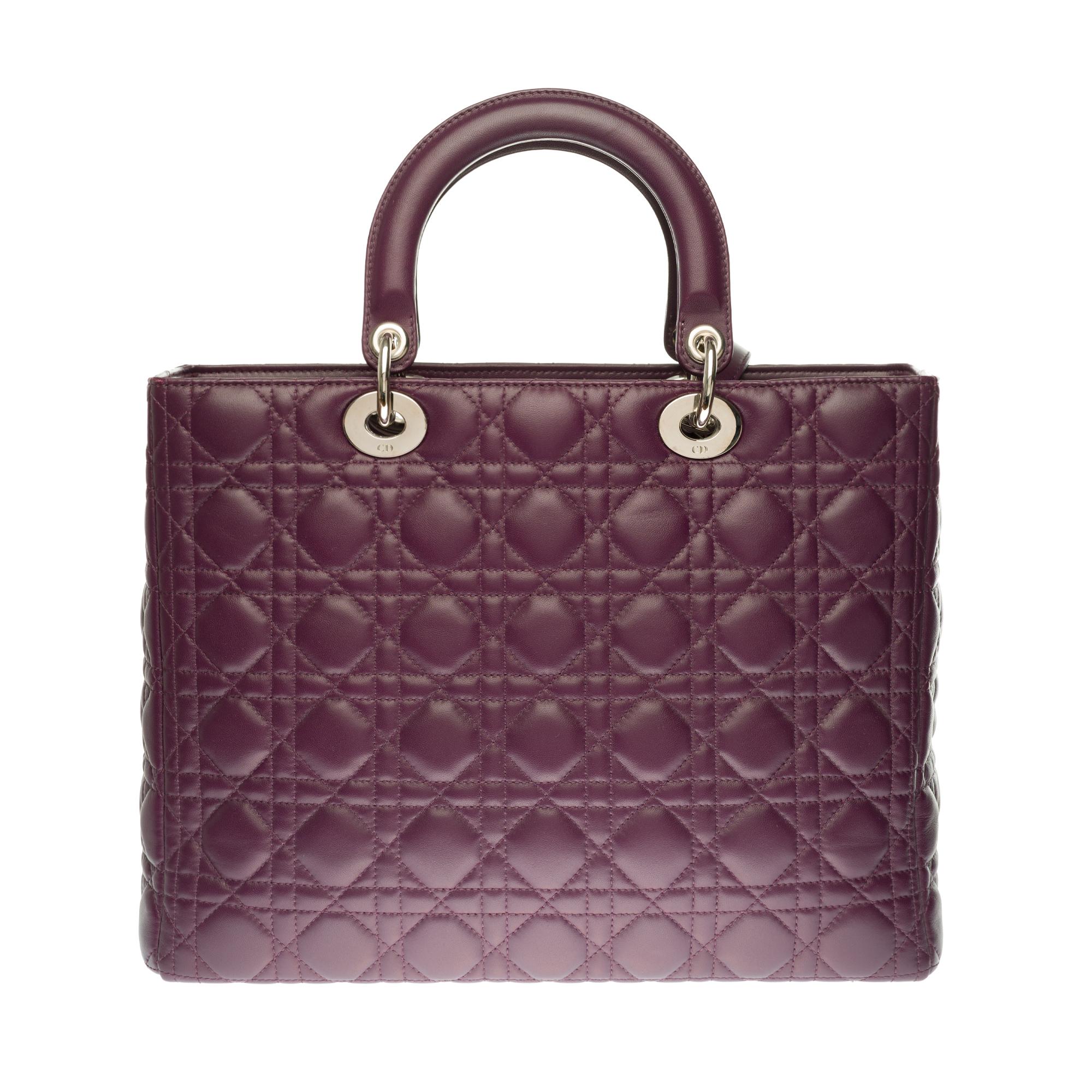 Very chic Dior Lady Dior large model (GM) shoulder bag in purple cannage leather, silver metal hardware, double handle in purple leather, removable shoulder strap handle in purple leather allowing a hand or shoulder support or shoulder strap.

It’s