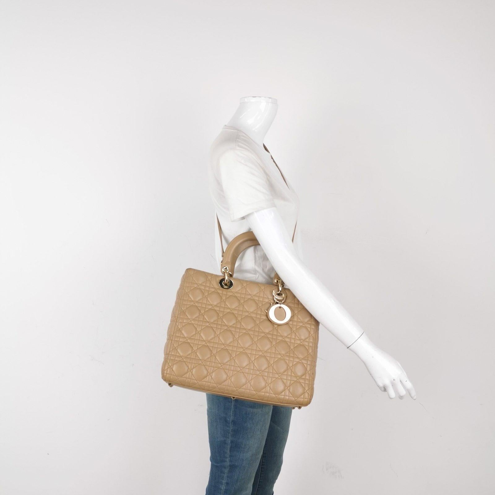 Lady Dior Large Bag Beige Lambskin Cannage Leather These are professional photos of the actual bag offered by Luxbags. Accentuate your look with the timeless style of Large Lady Dior, crafted in Beige Lambskin Leather. This classic bag features a
