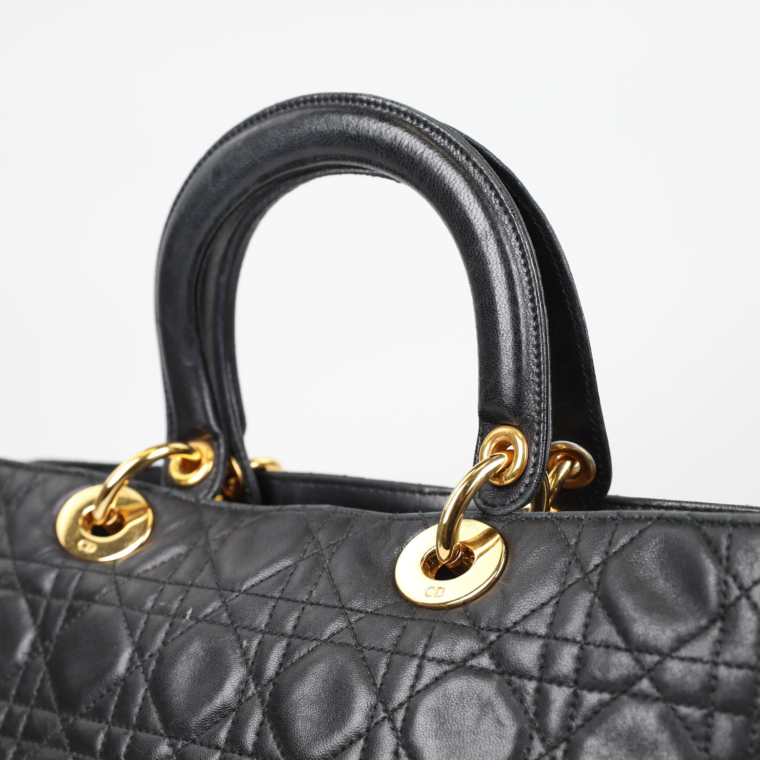 Looking for a chic and elegant bag with a vintage touch? This Christian Dior Lady Dior Cannage lambskin bag is made for you! This structured bag is crafted in quilted lambskin with a cannage motif embroidery. It features dangling DIOR charms that