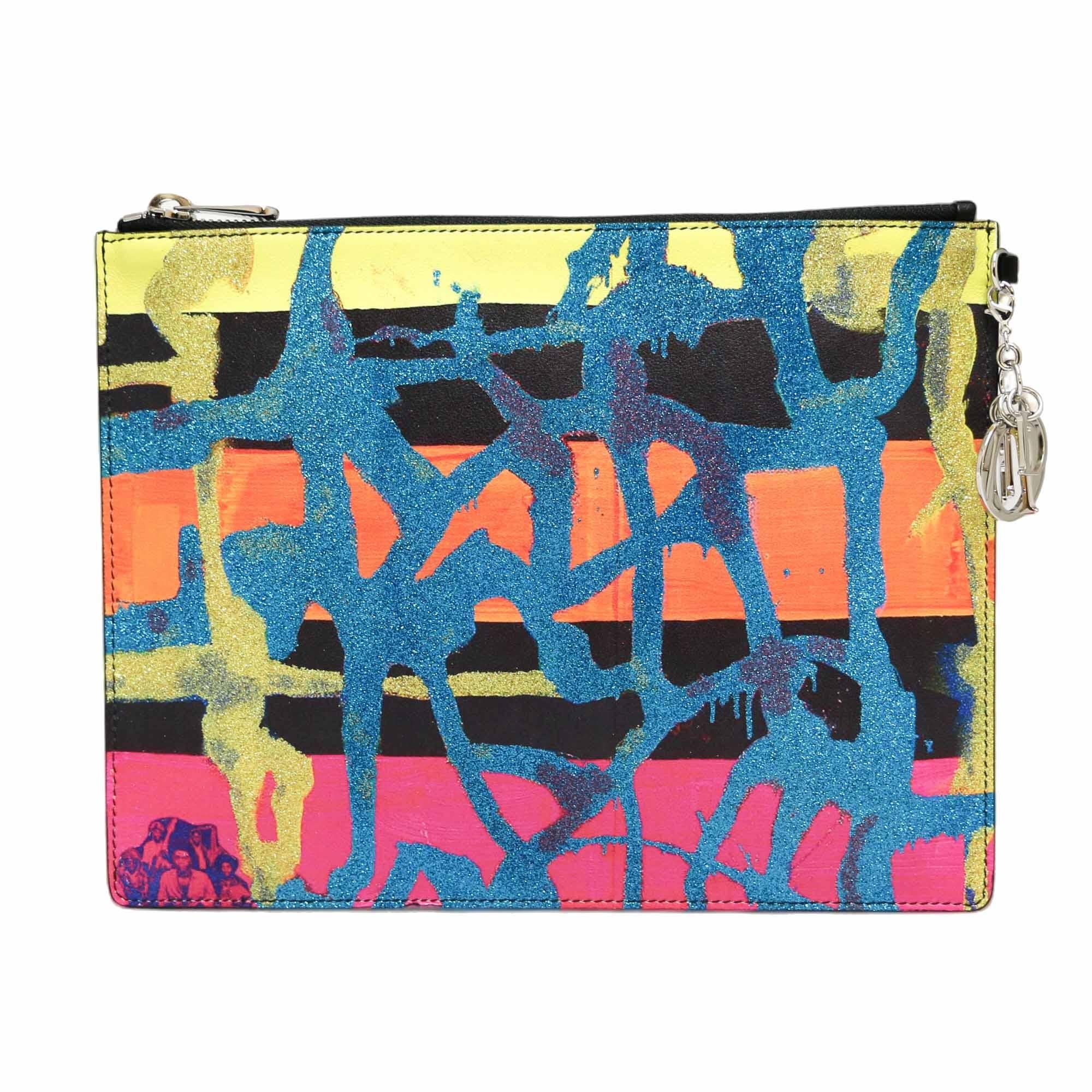 Amazing Lady DIOR clutch in collaboration with the contemporary artist Chris Martin 
Condition: very good
Made in Italy
Collection: Lady Dior
Material: leather, glitter
Interior: orange textile
Color: multicolor
Dimensions: 25 x 19 x 1 cm
Serial