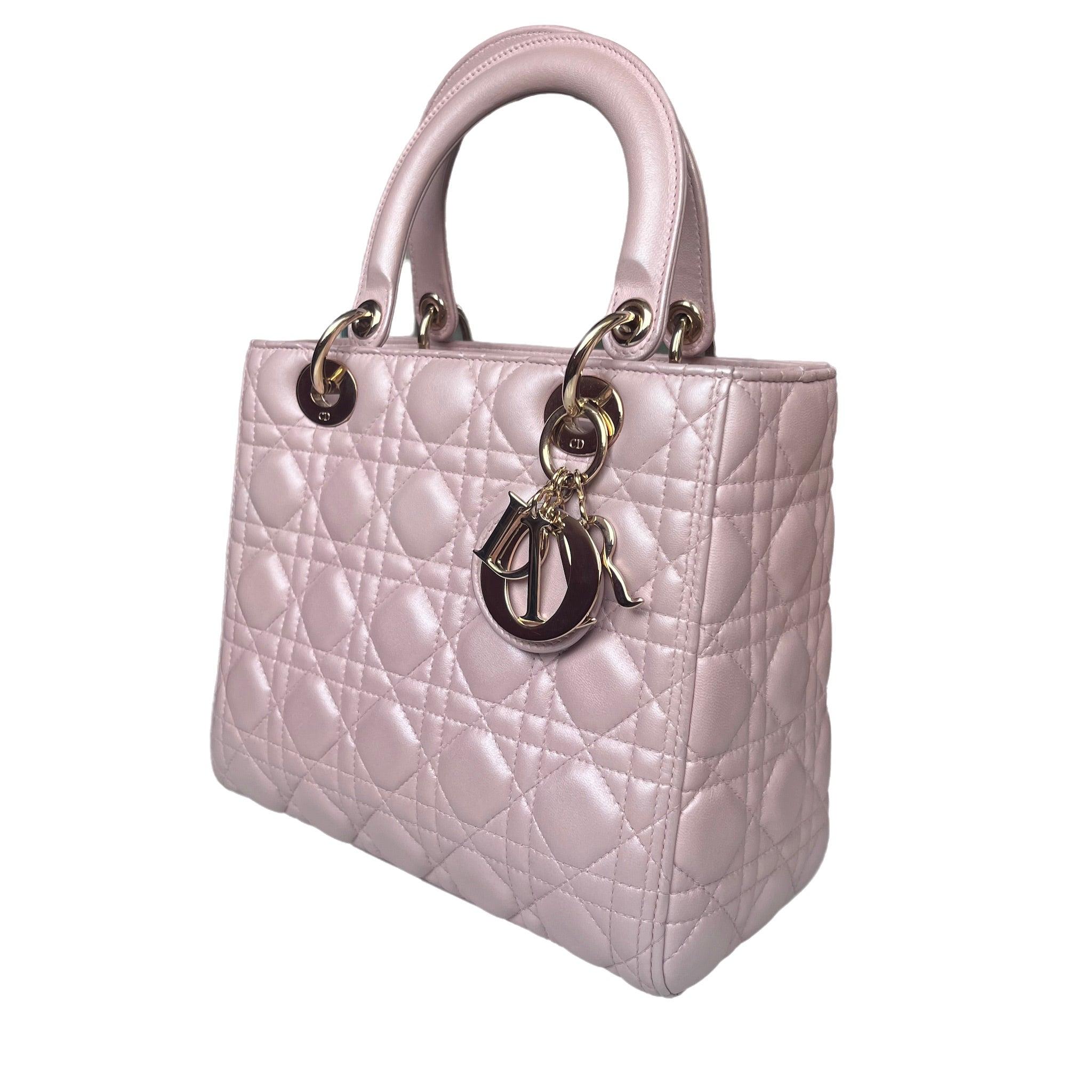 Lady Dior Medium Handbag Pearlescent Pink Cannage Leather Gold Hardware These are professional photos of the actual bag offered by Luxbags. The Lady Dior bag is an epitome of elegance and beauty. Accentuate your look with the timeless style of