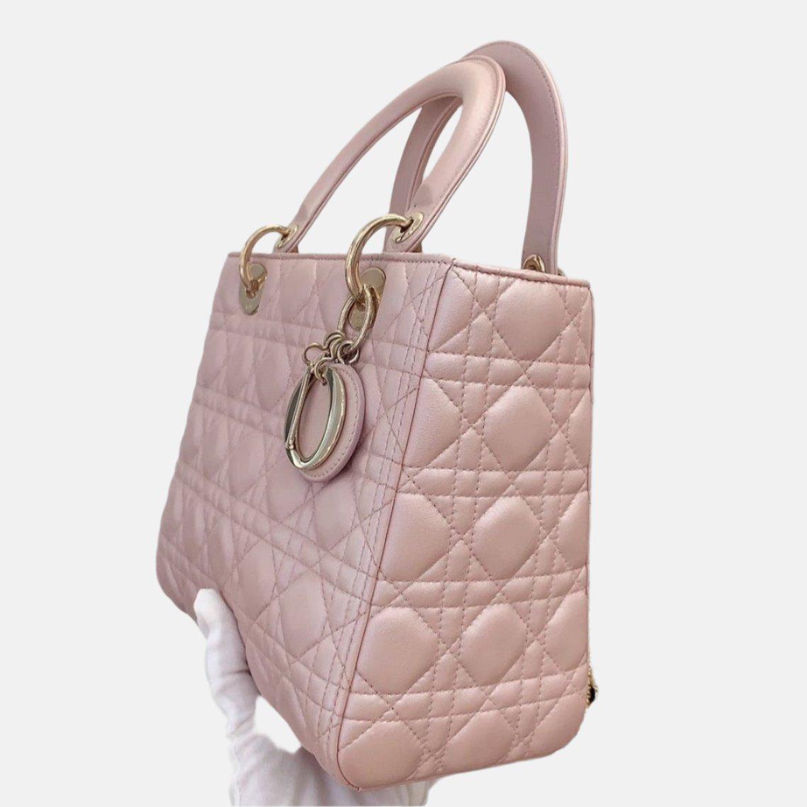 Lady Dior Medium Handbag Pearlescent Pink Cannage Leather Gold Hardware
  These are professional photos of the actual bag offered by Luxbags.
  The Lady Dior bag is an epitome of elegance and beauty. Accentuate your look with the timeless style of