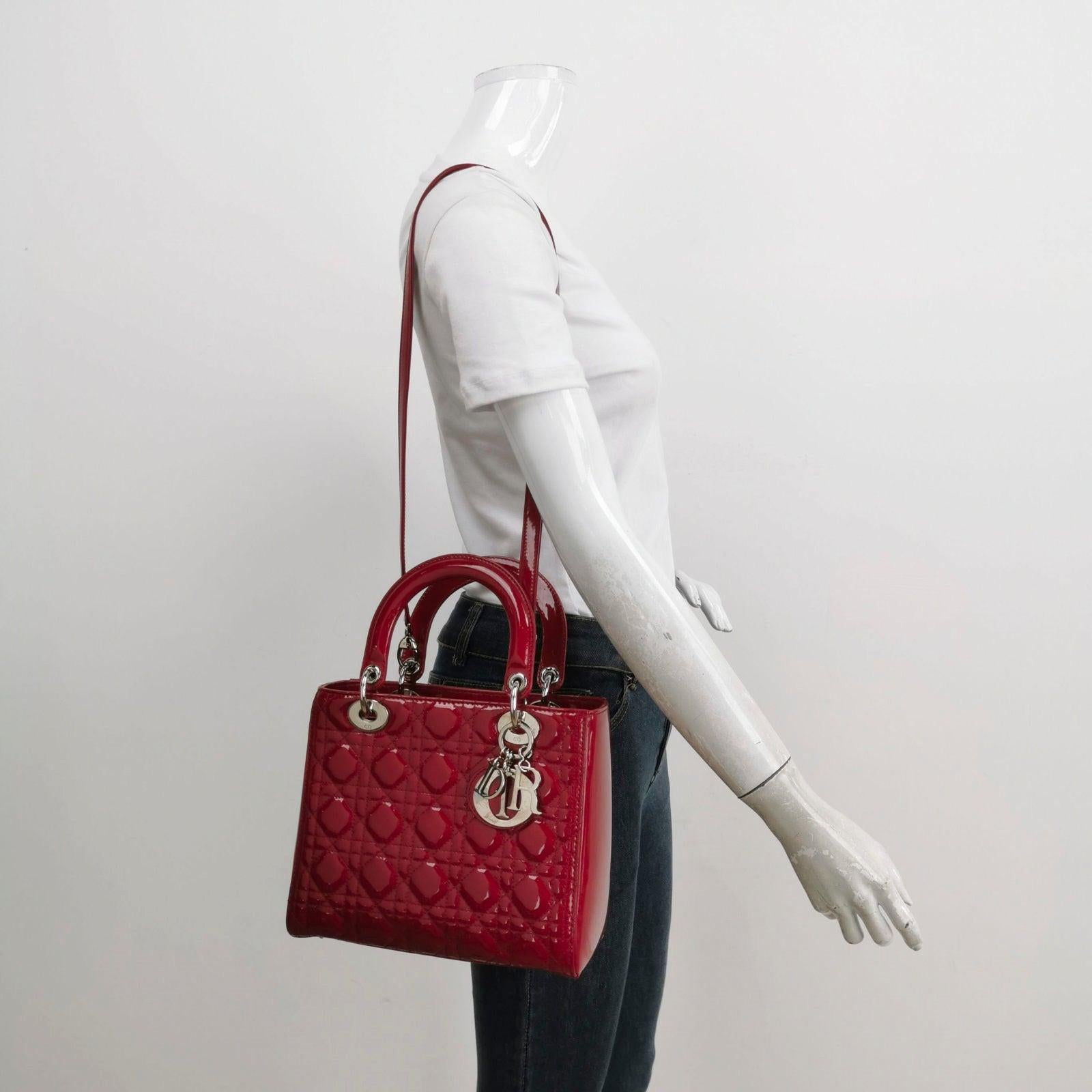 Lady Dior Medium Red Burgundy Patent Leather Handbag Silver Hardware These are professional photos of the actual bag offered by Luxbags. The Lady Dior bag is an epitome of elegance and beauty. Accentuate your look with the timeless style of Medium