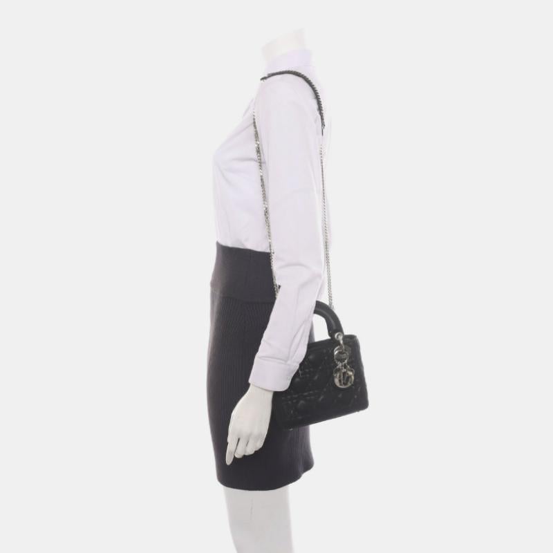 Lady Dior Mini Black Aged Calfskin Leather handbag with silver hardware Chain Strap
 These are professional photos of the actual bag.
 This Lady Dior Mini handbag features aged calfskin leather with a perforated texture decorated with silver