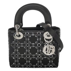 Lady Dior Mini in seta nera con cristalli e hardware in argento